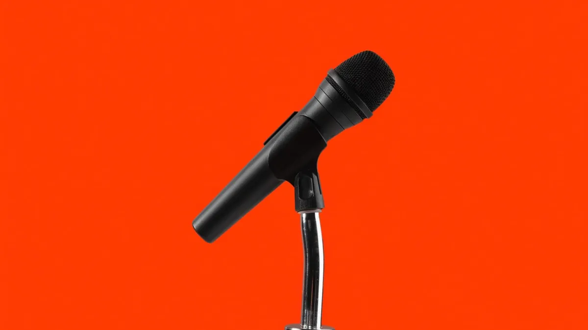 A plain microphone on a stand, cut out against a solid bright color.