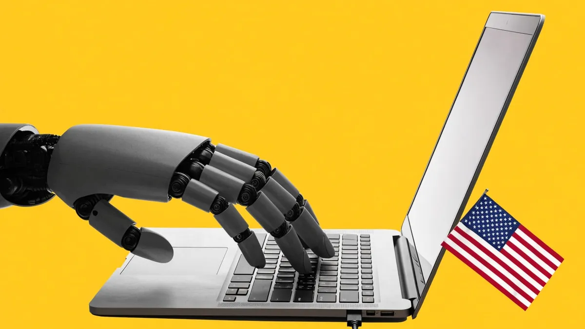 A robotic hand typing on an open laptop beside a small American flag, cut out against a solid yellow background.