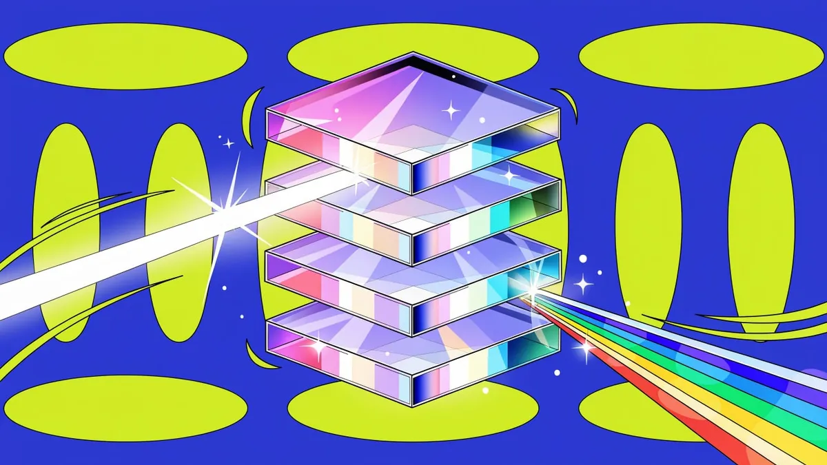 A stack of four glass slabs on a blue background, with a white beam entering on the left and splitting into a rainbow on the right.