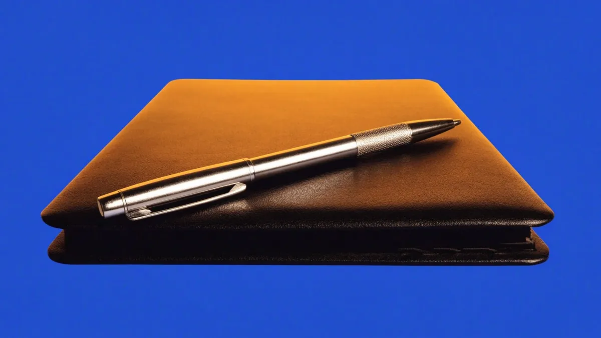A closed briefing folder with a pen resting on top, cut out against a solid bright color.